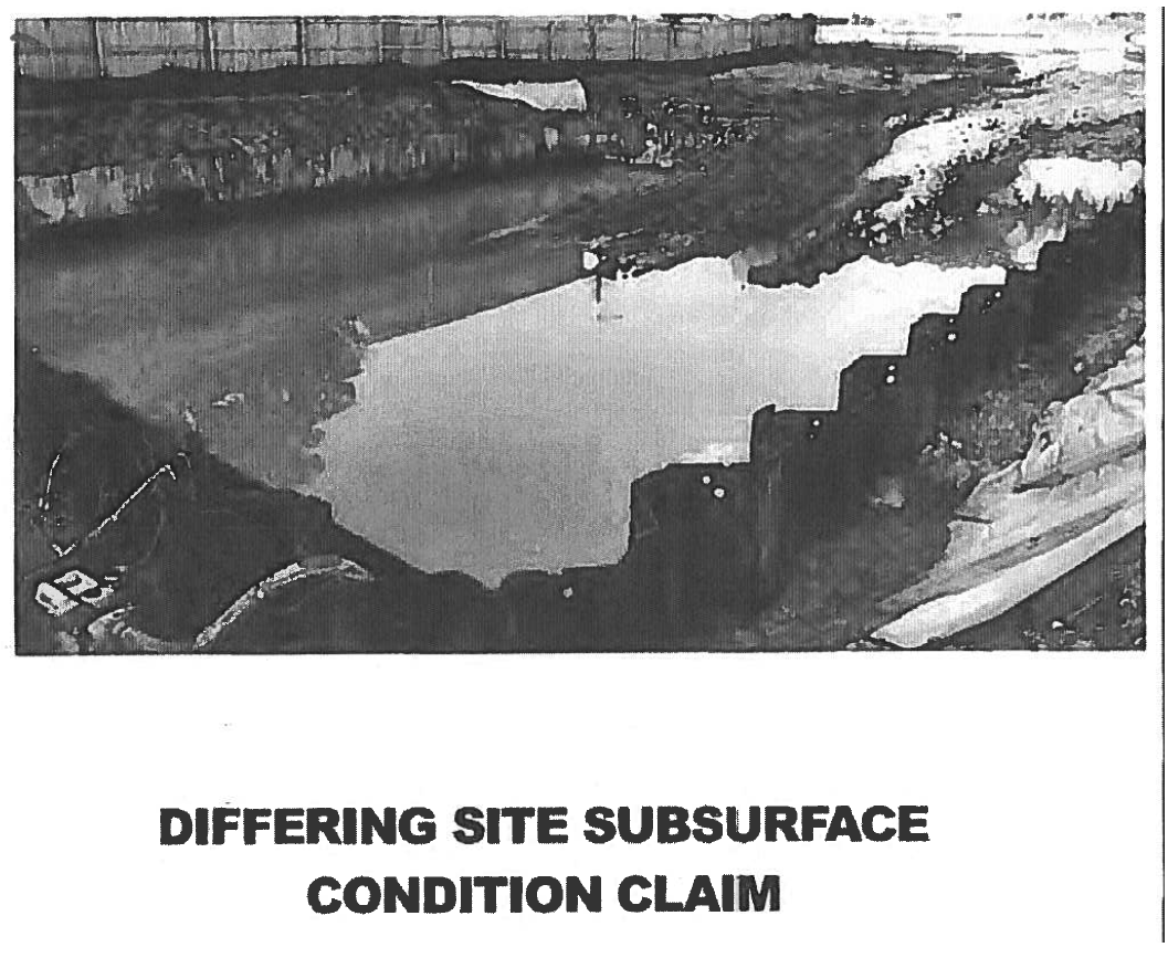 Photo of the construction site with subsurface water contained by metal pilings.